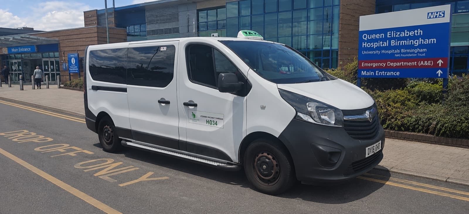Licensed minibus outside Queen Elizabeth Hospital Birmingham